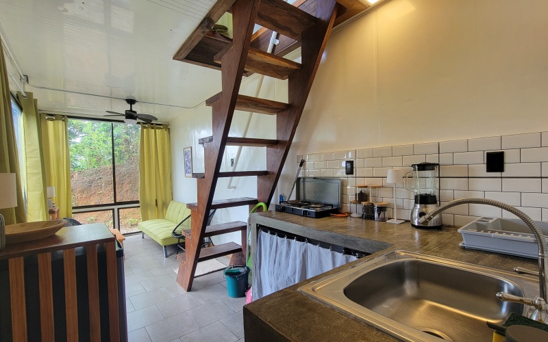 Steep stairs to the bedroom and balcony