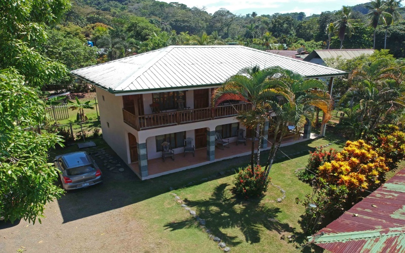 An aerial view of a small 6 room hotel for sale in central Pavones Costa Rica